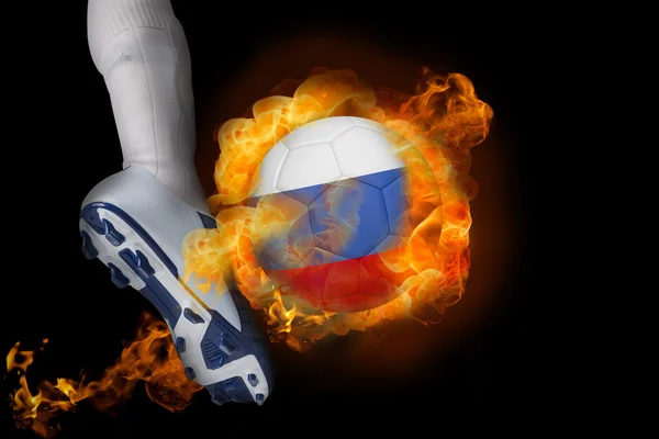 Football player kicking flaming russia ball — Stock Photo, Image