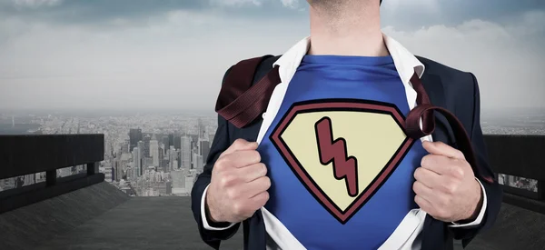 Businessman opening shirt in superhero style — Stock Photo, Image