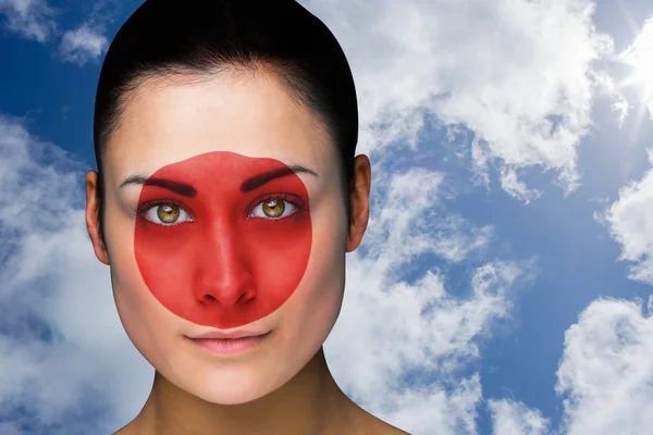 Composite image of beautiful brunette in japan facepaint — Stock Photo, Image