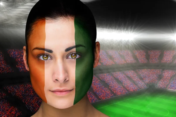 Composite image of beautiful ivory coast fan in face paint — Stock Photo, Image