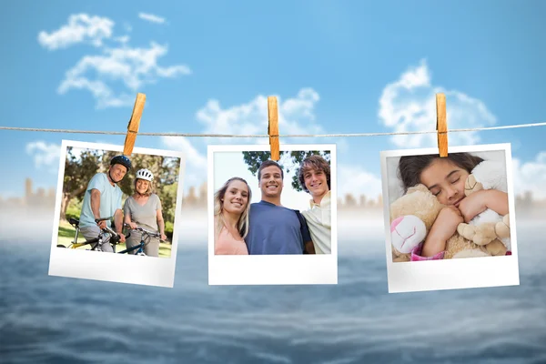 Composite image of instant photos hanging on a line — Stock Photo, Image