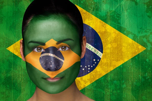 Imagem composta de belo fã de futebol na pintura facial — Fotografia de Stock