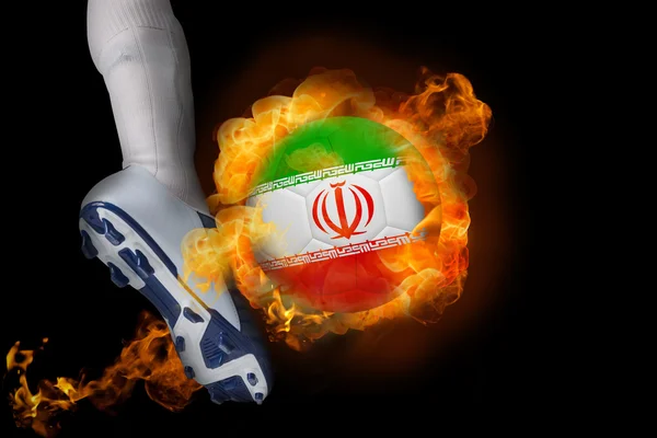 Football player kicking flaming iran ball — Stock Photo, Image