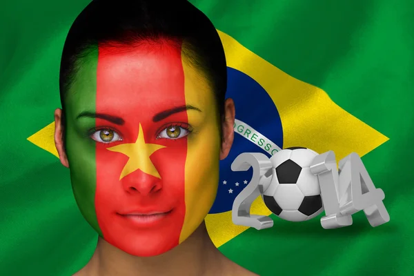 Imagen compuesta del ventilador de fútbol camerún en pintura facial — Foto de Stock