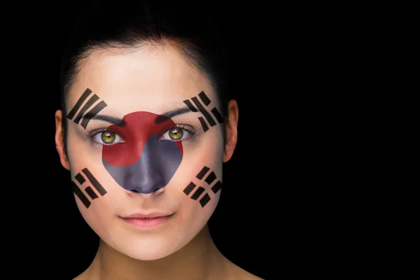 Imagen compuesta del ventilador de fútbol coreano en pintura facial — Foto de Stock