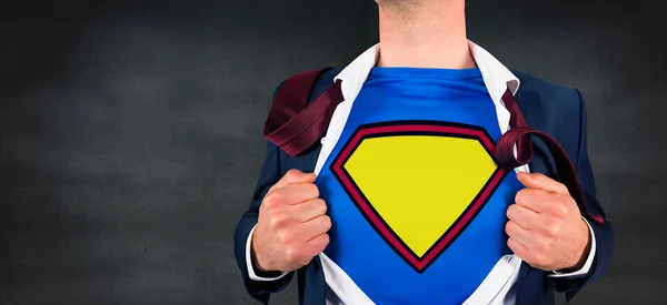 Businessman opening shirt in superhero style — Stock Photo, Image