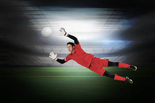 Composite image of fit goal keeper jumping up — Stock Photo, Image