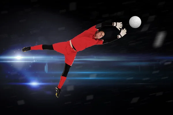 Composite image of fit goal keeper jumping up — Stock Photo, Image