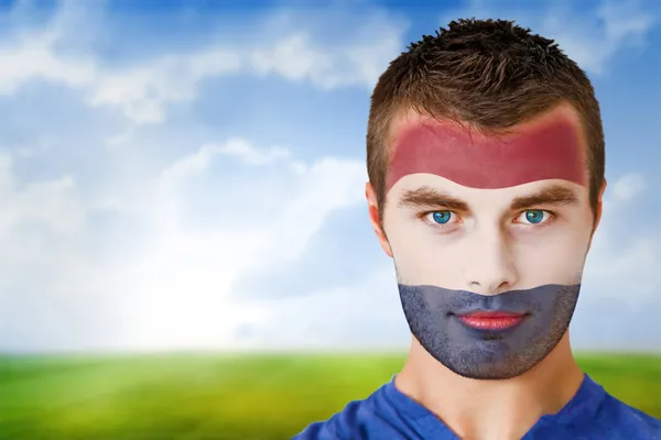 Netherlands football fan in face paint — Stock Photo, Image