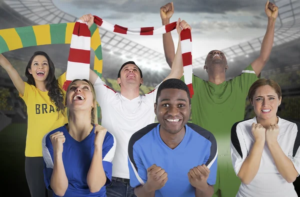 Composite image of various football fans — Stock Photo, Image