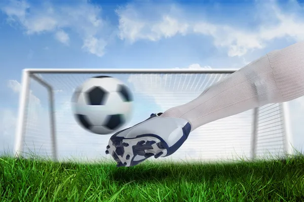 Close up of football player kicking ball — Stock Photo, Image