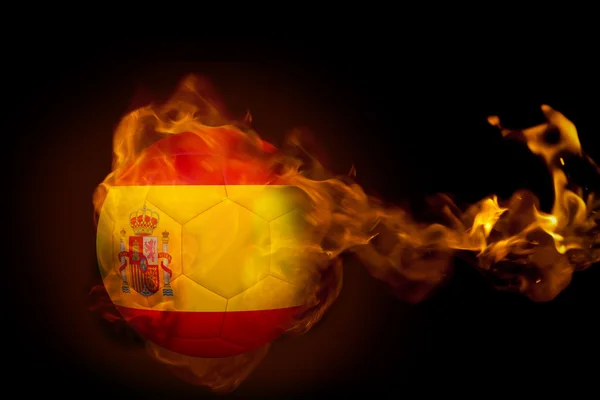 Композитне зображення вогню, що оточує м'яч Іспанії — стокове фото