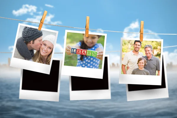 Zusammengesetztes Bild von Sofortfotos, die an einer Linie hängen — Stockfoto