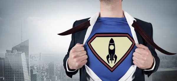 Businessman opening shirt in superhero style — Stock Photo, Image