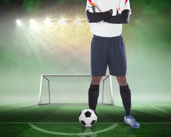 Composite image of goalkeeper standing with ball — Stock Photo, Image