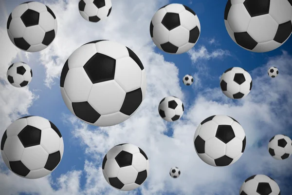 Composite image of black and white footballs — Stock Photo, Image