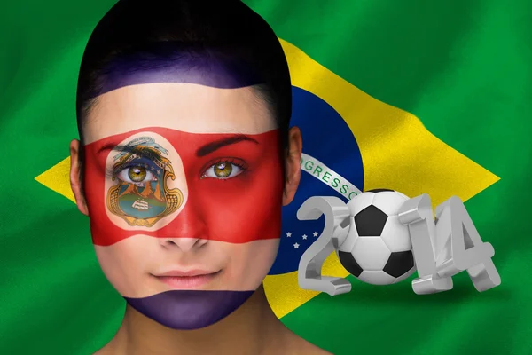 Imagen compuesta del ventilador de fútbol de Costa Rica en pintura facial — Foto de Stock