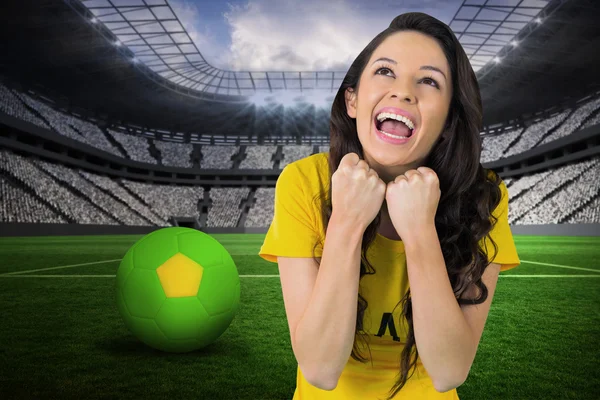 Excited football fan in brasil tshirt — Stock Photo, Image