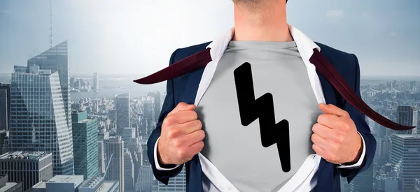 Composite image of businessman opening shirt in superhero style — Stock Photo, Image