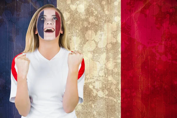 Excited france fan in face paint — Stock Photo, Image