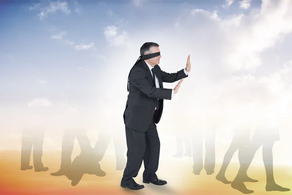 Mature businessman in a blindfold — Stock Photo, Image