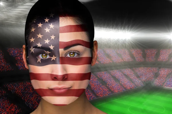Composite image of beautiful america fan in face paint — Stock Photo, Image