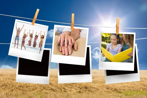 Zusammengesetztes Bild von Sofortfotos, die an einer Linie hängen — Stockfoto