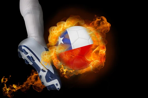 Football player kicking flaming chile ball — Stock Photo, Image