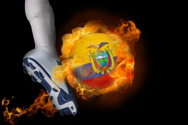 Football player kicking flaming ecuador ball — Stock Photo, Image