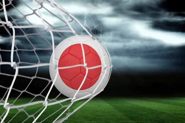 Obraz kompozytowy o piłce nożnej w Japonii kolory w tylnej części sieci — Zdjęcie stockowe