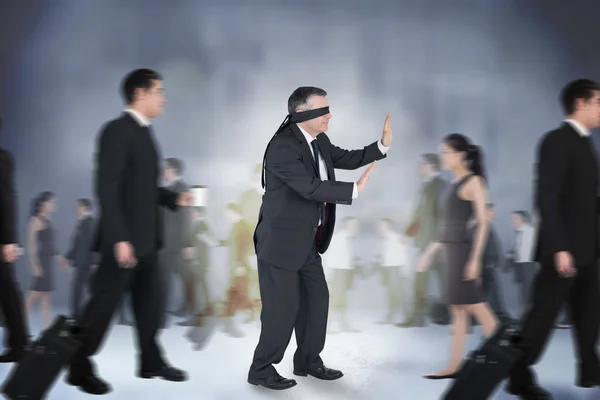 Composite image of mature businessman in a blindfold — ストック写真
