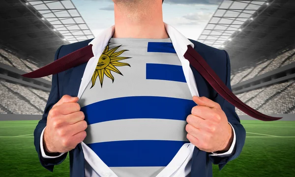 Businessman opening shirt to reveal uruguay flag — Stock Photo, Image