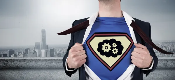 Businessman opening shirt in superhero style — Stock Photo, Image