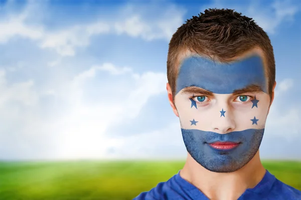 Honduras ventilador de futebol em pintura facial — Fotografia de Stock