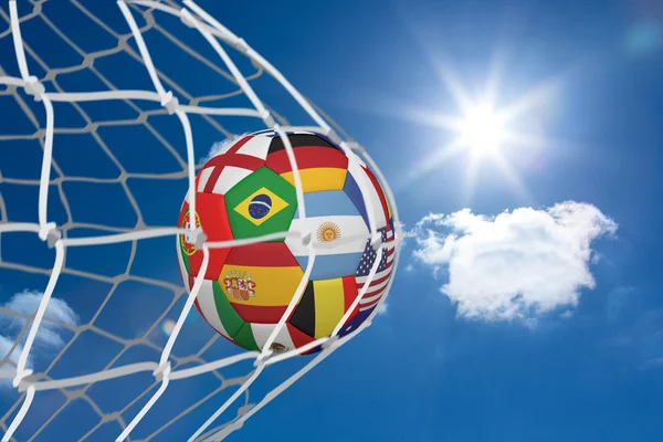 Composite image of football in multi national colours at back of — Stock Photo, Image