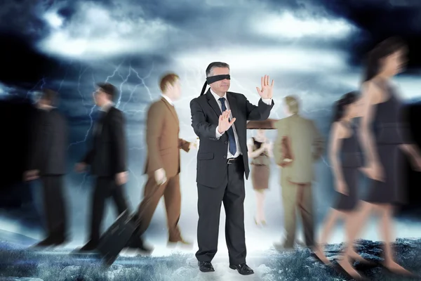 Mature businessman in a blindfold — Stock Photo, Image