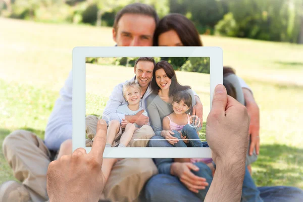 Composite image of hand holding tablet pc — Stock Photo, Image