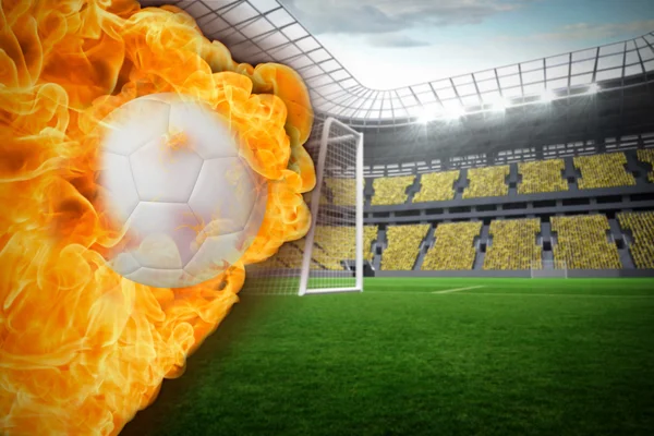 Composite image of fire surrounding football — Stock Photo, Image
