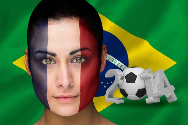 Imagem composta do fã de futebol france em pintura facial — Fotografia de Stock