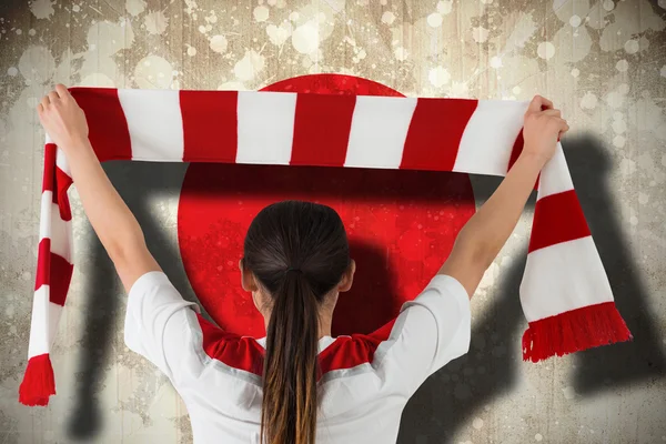 Composite image of football fan waving red and white scarf — Stock Photo, Image