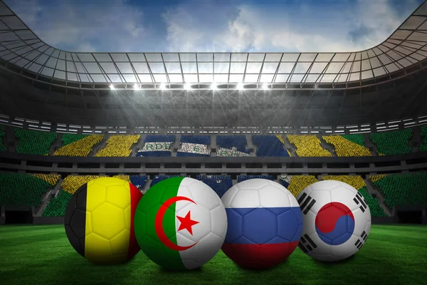 Imagen compuesta de balones de fútbol en colores del grupo h para la copa del mundo — Foto de Stock