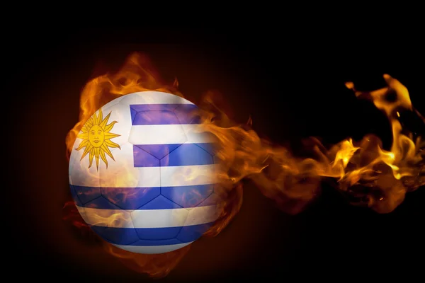 Imagem composta de fogo em torno de bola uruguai — Fotografia de Stock