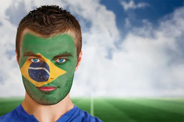 Brazil football fan in face paint — Stock Photo, Image