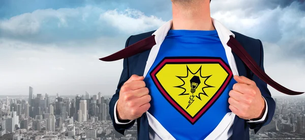 Businessman opening shirt in superhero style — Stock Photo, Image