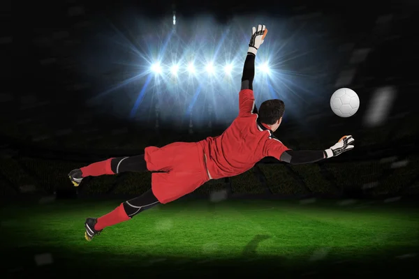Composite image of fit goal keeper jumping up — Stock Photo, Image