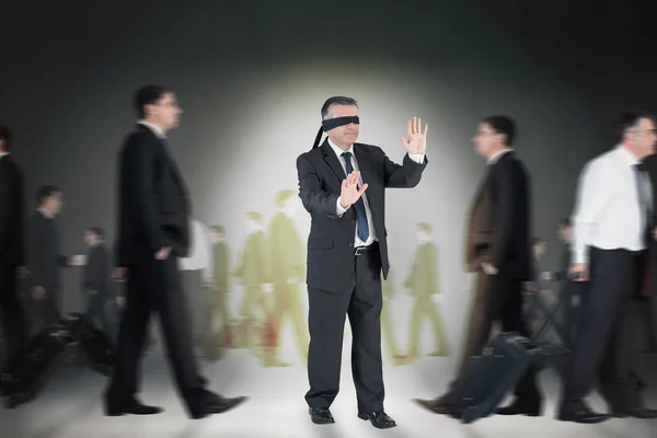 Composite image of mature businessman in a blindfold — Stock Photo, Image