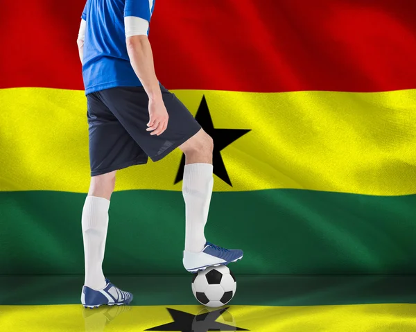 Composite image of football player standing with ball — Stock Photo, Image