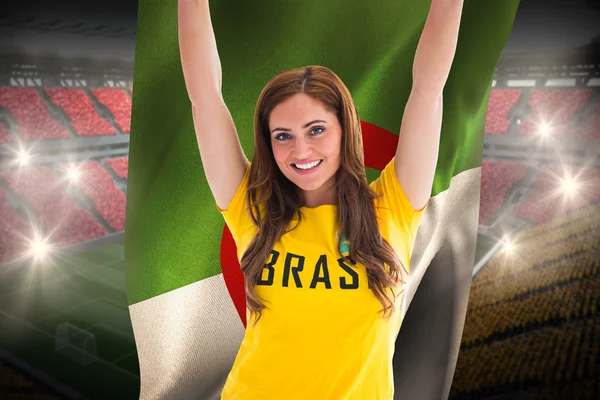 Pretty football fan in brasil t-shirt holding flag — Stock Photo, Image