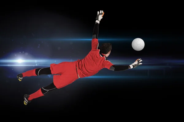 Composite image of fit goal keeper jumping up — Stock Photo, Image