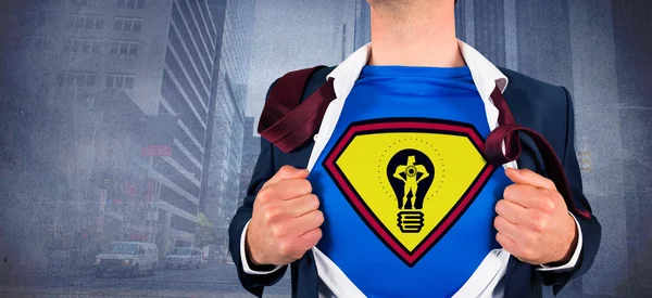 Businessman opening shirt in superhero style — Stock Photo, Image